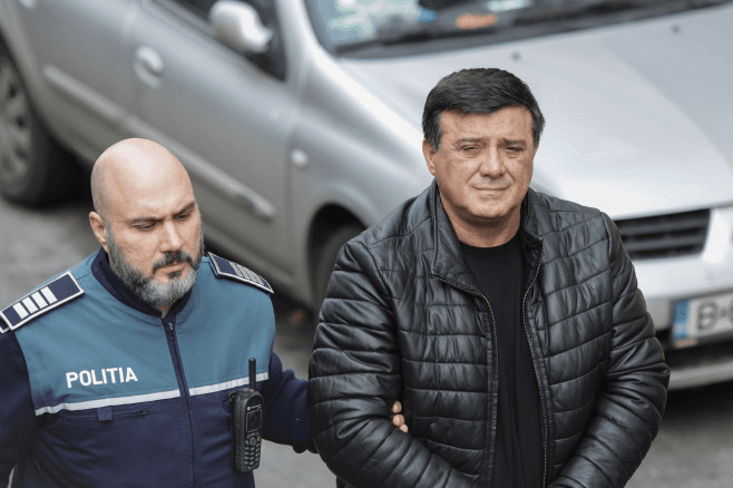 Imaginile dimineții: Niculae Bădălău, în cătușe