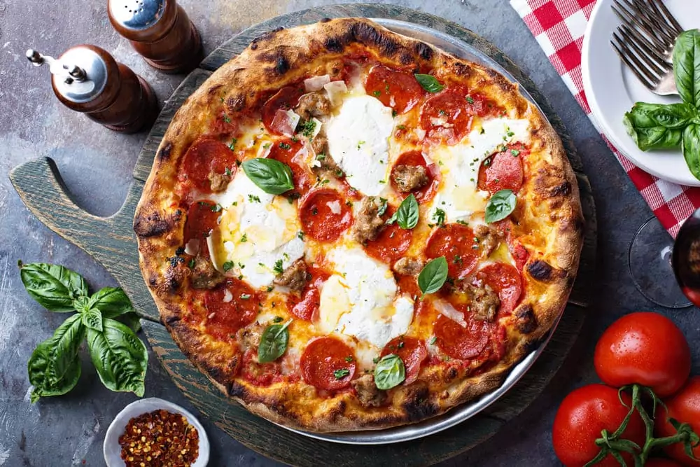 Pizza s-a scumpit cu 6,5% în România, anul trecut